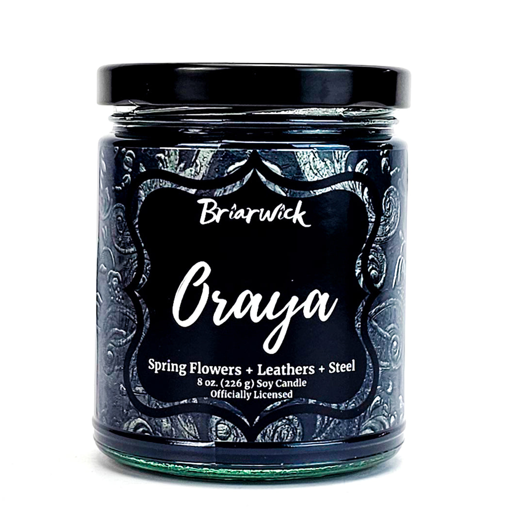Oraya 8oz charcoal candle with black ornamental design on a white background