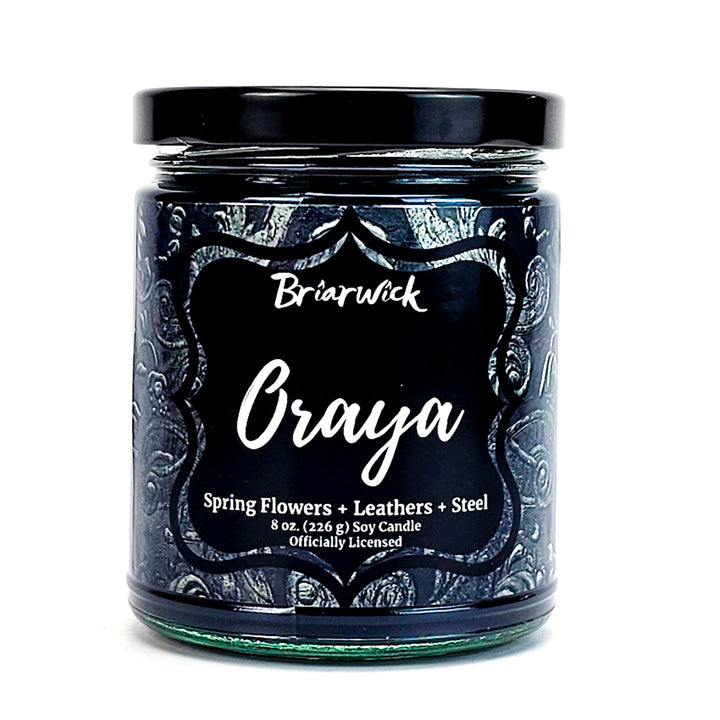 Oraya 8oz charcoal candle with black ornamental design on a white background