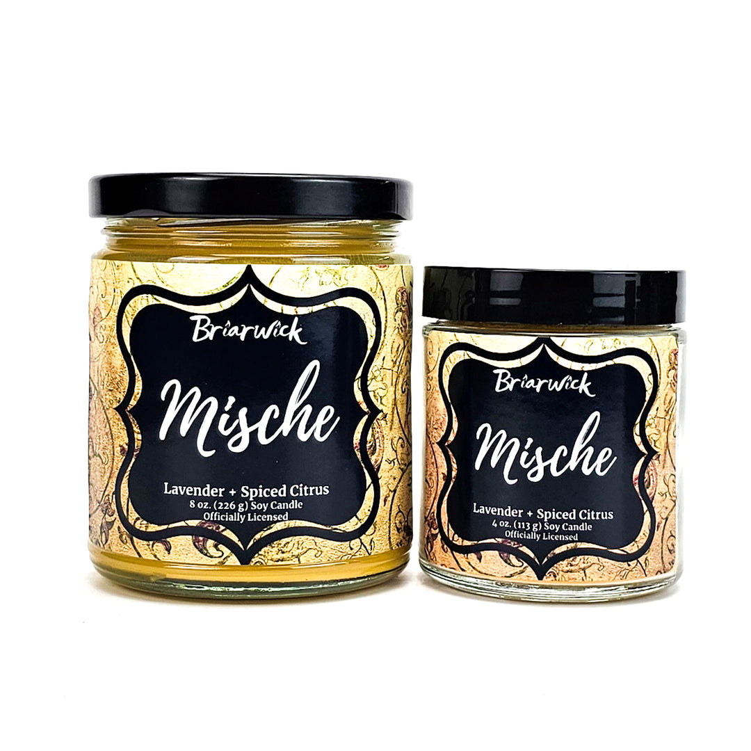 Mische 8oz & 4oz custard yellow candles with yellow ornamental designs on a white background