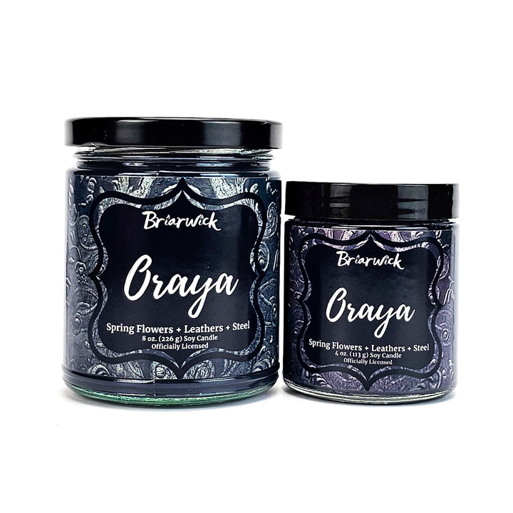 Oraya 8oz & 4oz charcoal candles with black ornamental designs on a white background