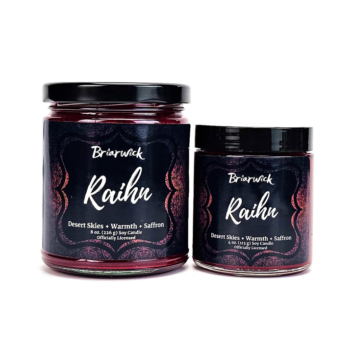Raihn 8oz & 4oz garnet candles with red ornamental designs on a white background