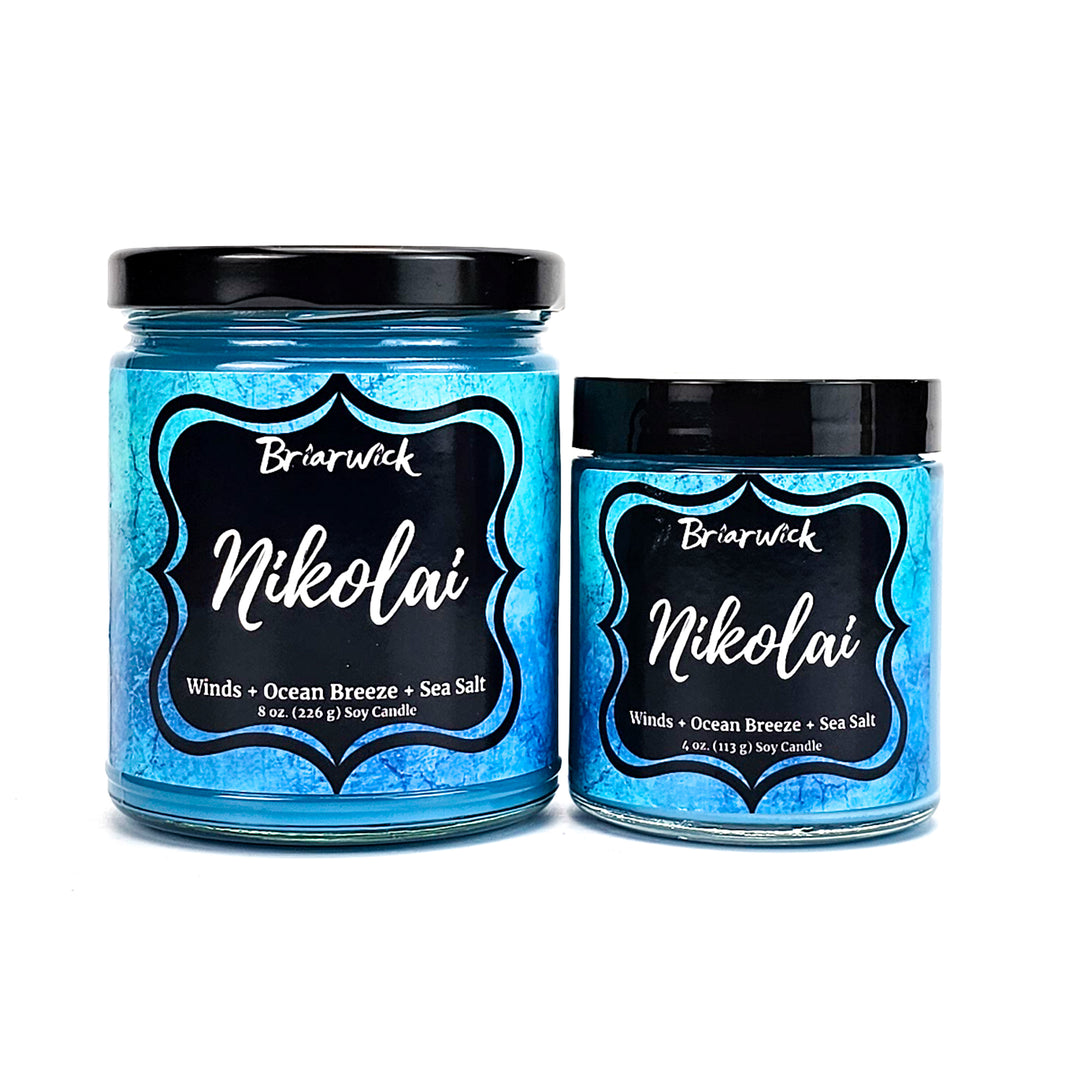 two jars of blue colored powder on a white background