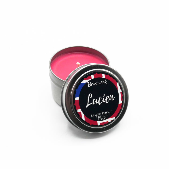a tin of pink lip bale on a white background