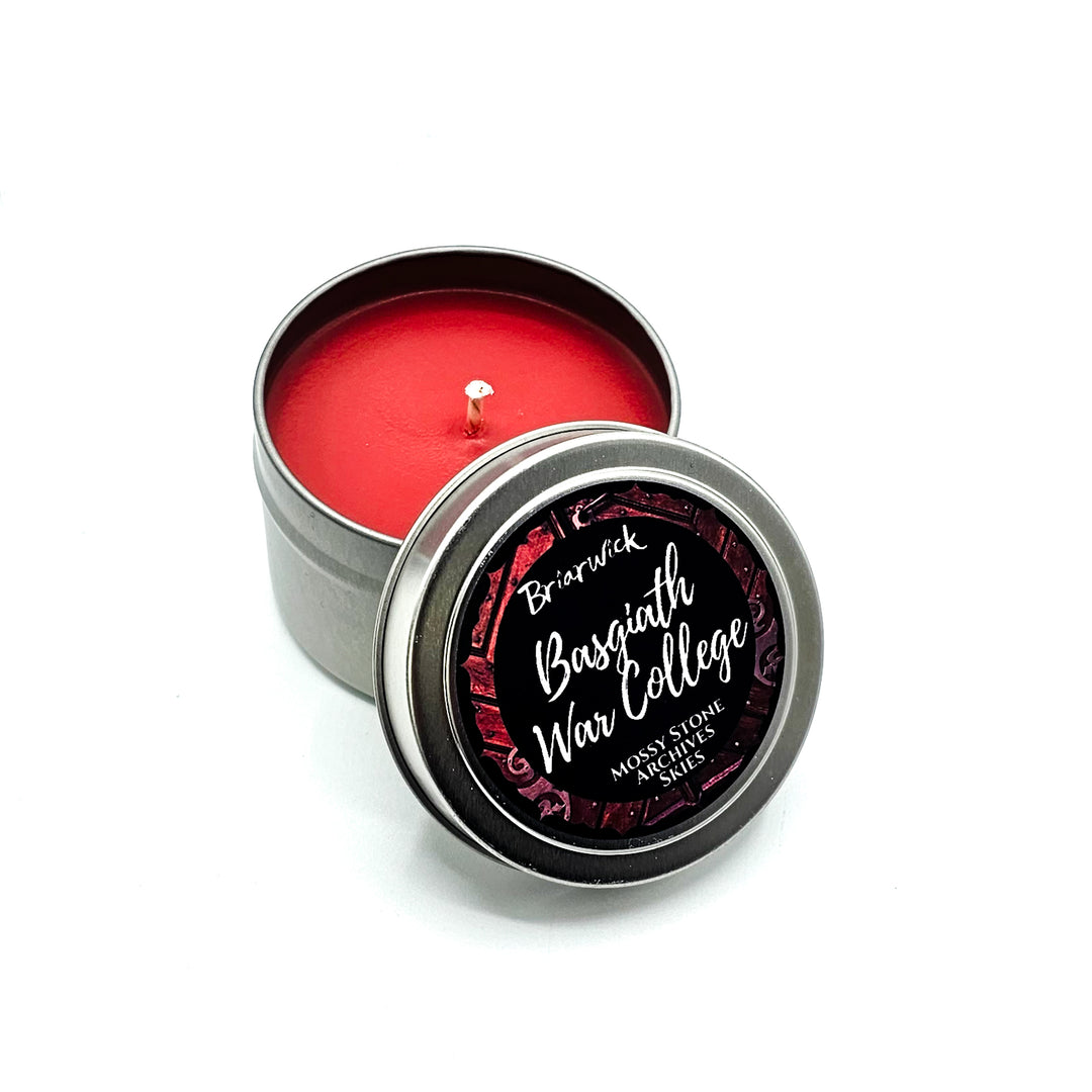 a small tin with a red candle inside of it