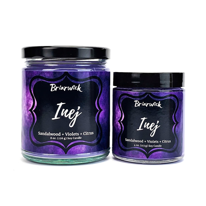 two jars of candle with labels on them