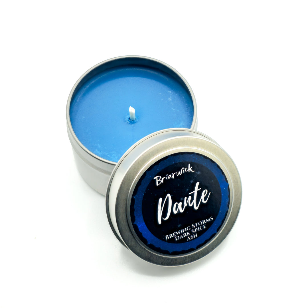 a blue tin with a candle inside of it