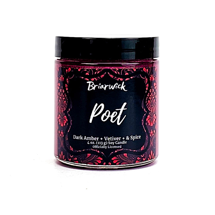 Poet 4oz cherry red candle with red ornamental design on a white background