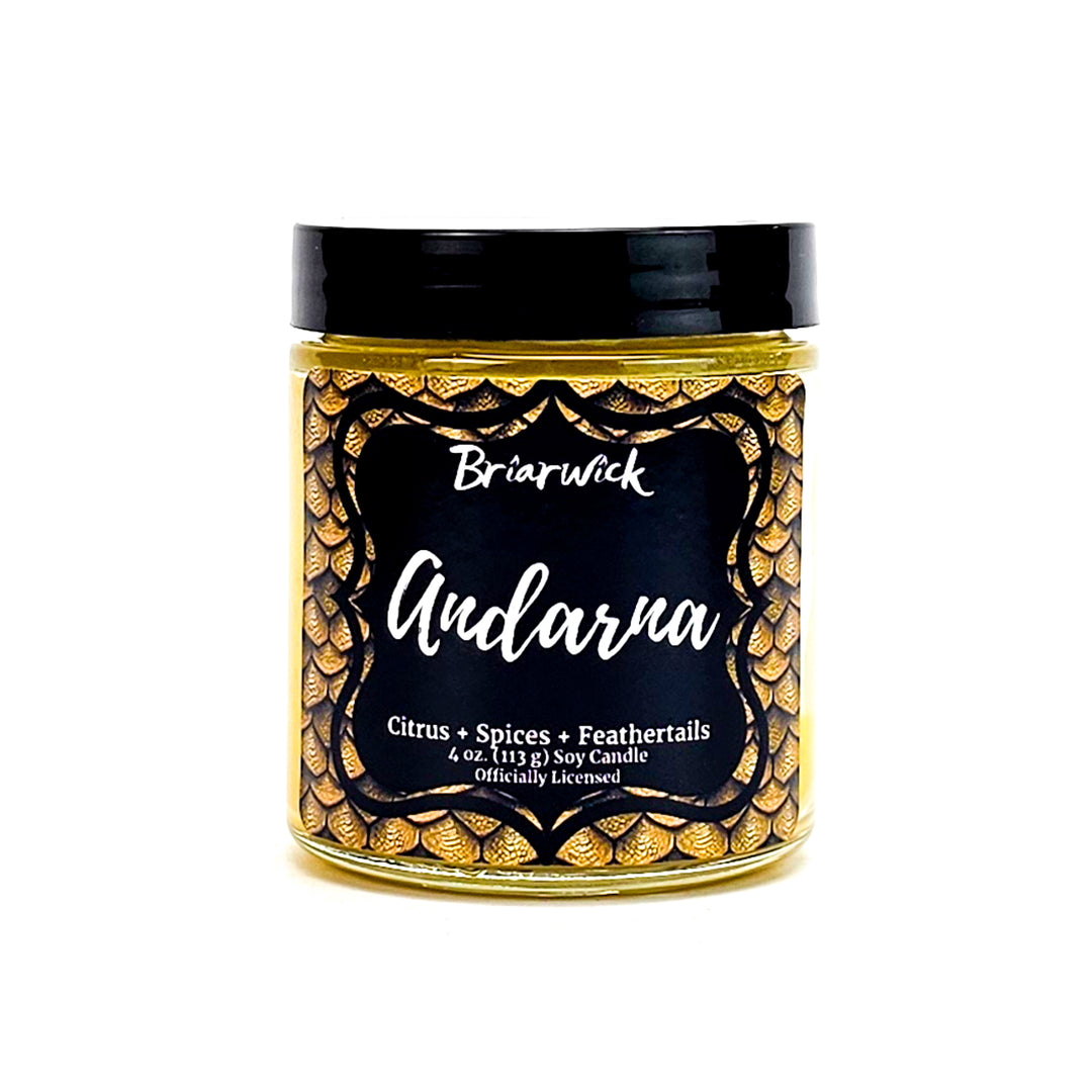 Andarna 4oz canary yellow candle with yellow dragon scale design on a white background