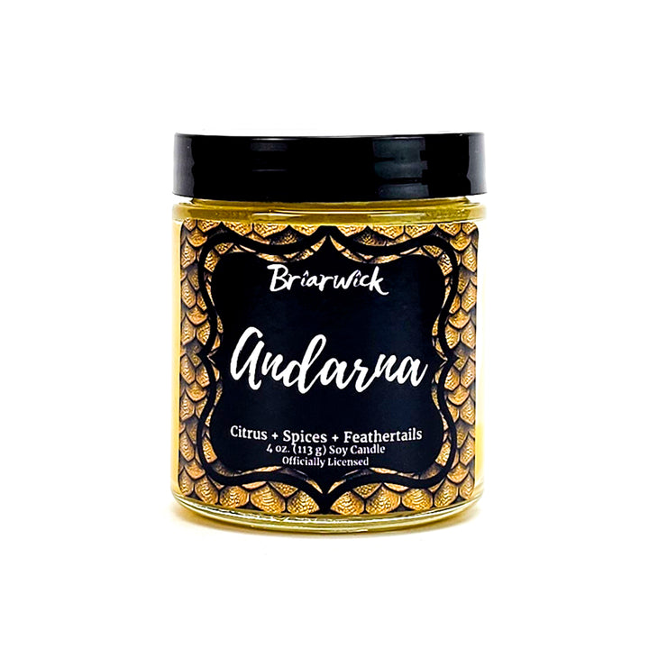 Andarna 4oz canary yellow candle with yellow dragon scale design on a white background