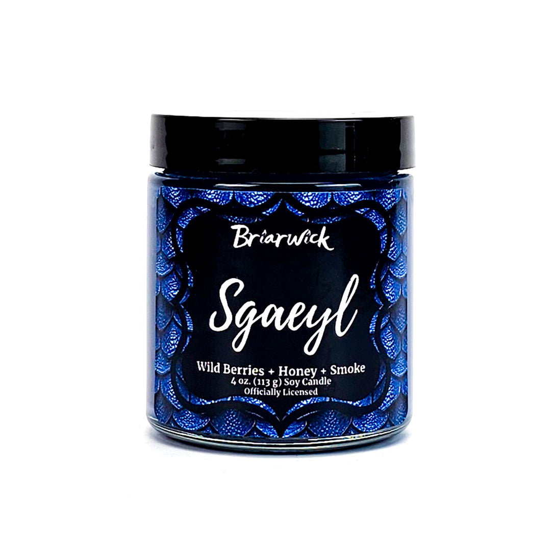 Sgaeyl 4oz navy candle with blue dragon scale design on a white background