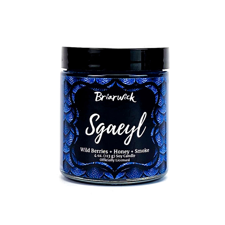 Sgaeyl 4oz navy candle with blue dragon scale design on a white background