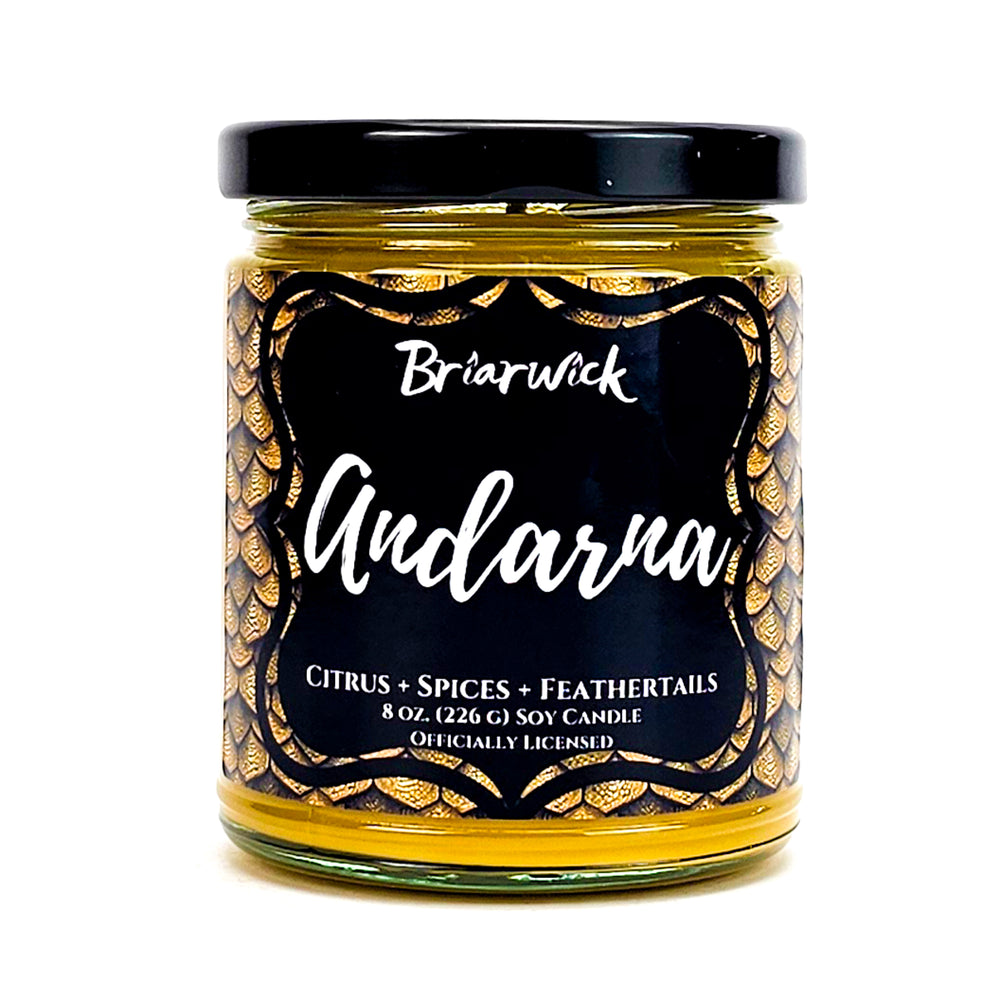 Andarna 8oz canary yellow candle with yellow dragon scale label on a white background