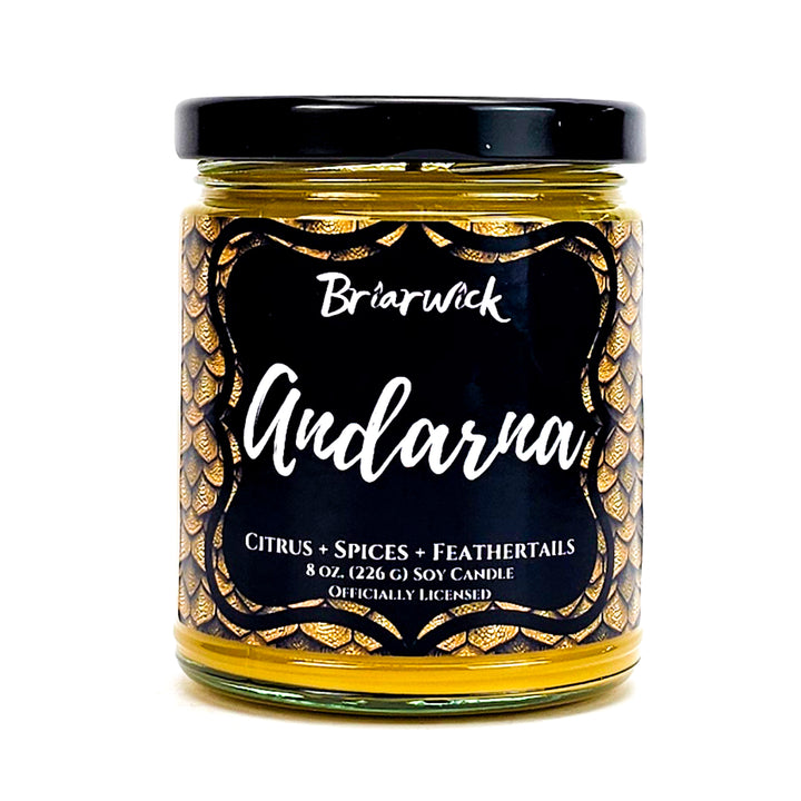 Andarna 8oz canary yellow candle with yellow dragon scale design on a white background