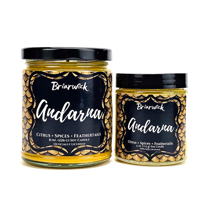 Andarna 8oz & 4oz canary yellow candles with yellow dragon scale designs on a white background