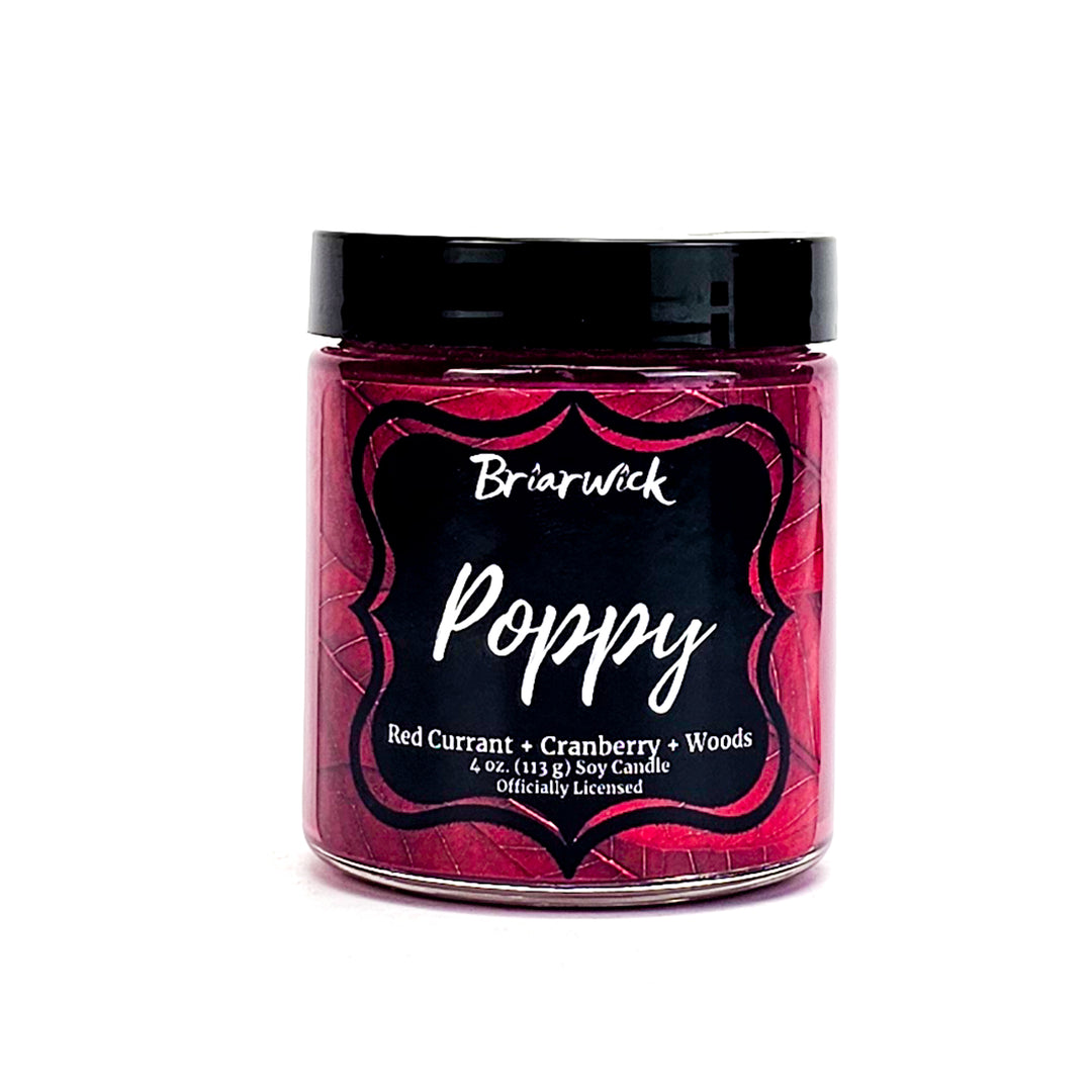 Poppy 4oz burgundy candle with red leaf design on a white background