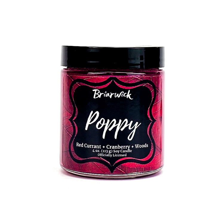 Poppy 4oz burgundy candle with red leaf design on a white background
