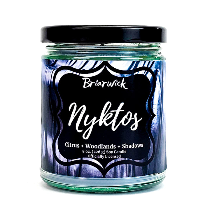 Nyktos 8oz flint gray candle with black & white textured design on a white background