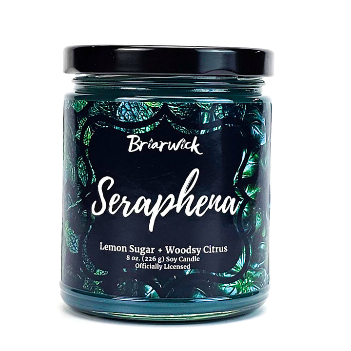 Seraphena 8oz dark olive candle with green leaf design on a white background