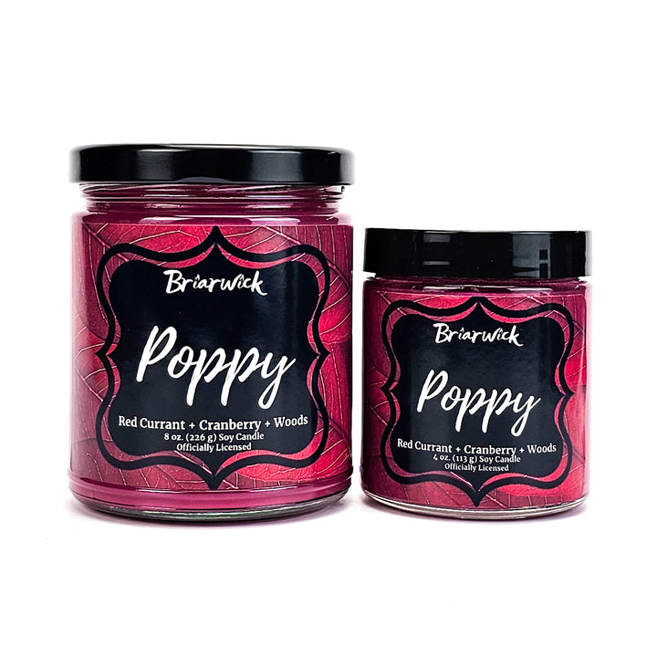 Poppy 8oz & 4oz burgundy candles with red leaf designs on a white background