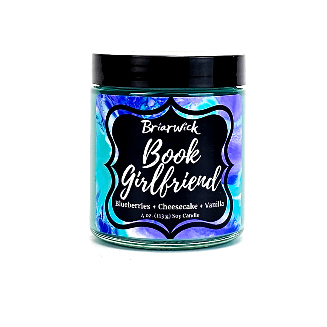 Book Girlfriend 4oz seafoam candle with blue textured design on a white background