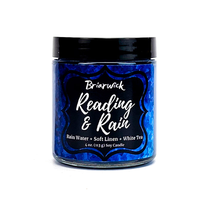 Reading & Rain 4oz navy candle with blue textured design on a white background