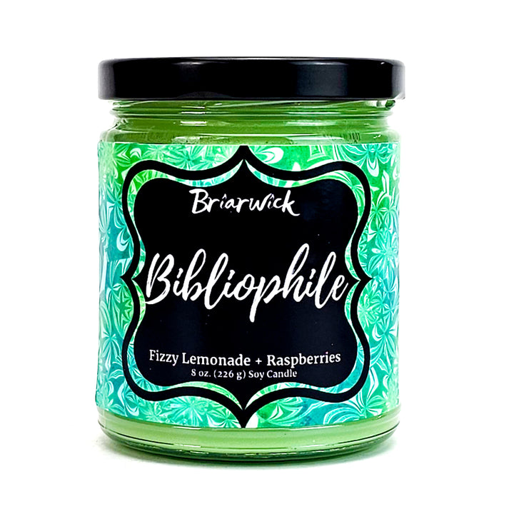 Bibliophile 8oz key lime candle with green patterned design on a white background