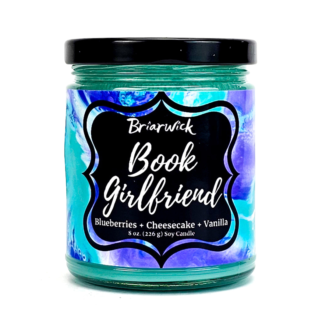 Book Girlfriend 8oz seafoam candle with blue textured design on a white background