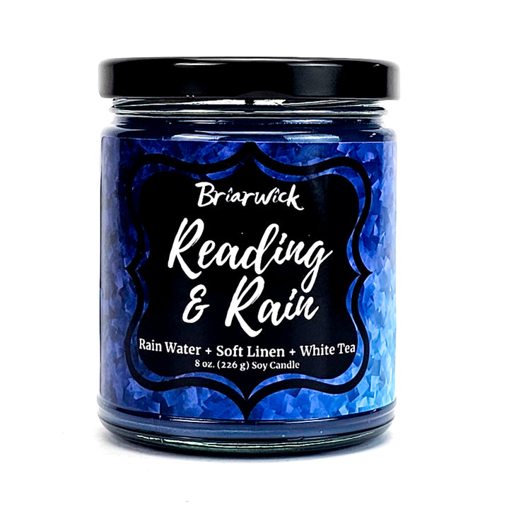 Reading & Rain 8oz navy candle with blue textured design on a white background