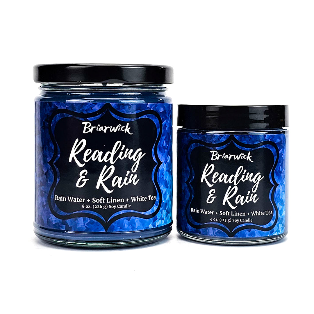 Reading & Rain 8oz & 4oz navy candles with blue textured designs on a white background