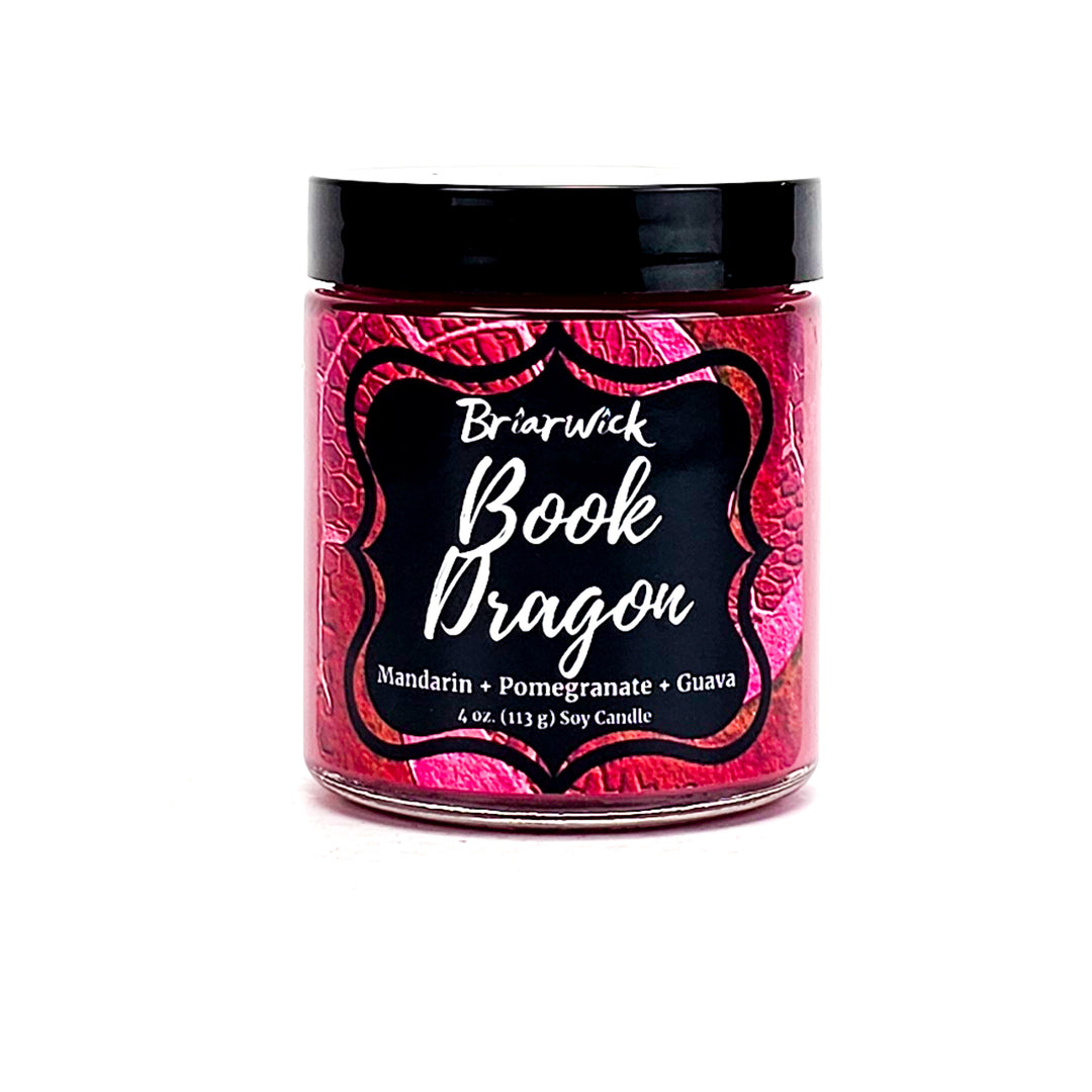 Book Dragon 4oz maroon candle with maroon scale design on a white background