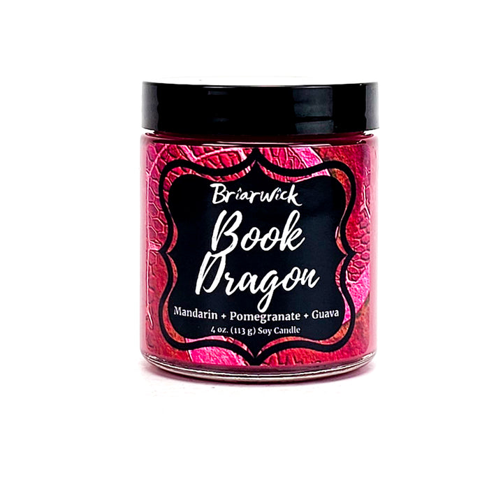 Book Dragon 4oz maroon candle with maroon scale design on a white background