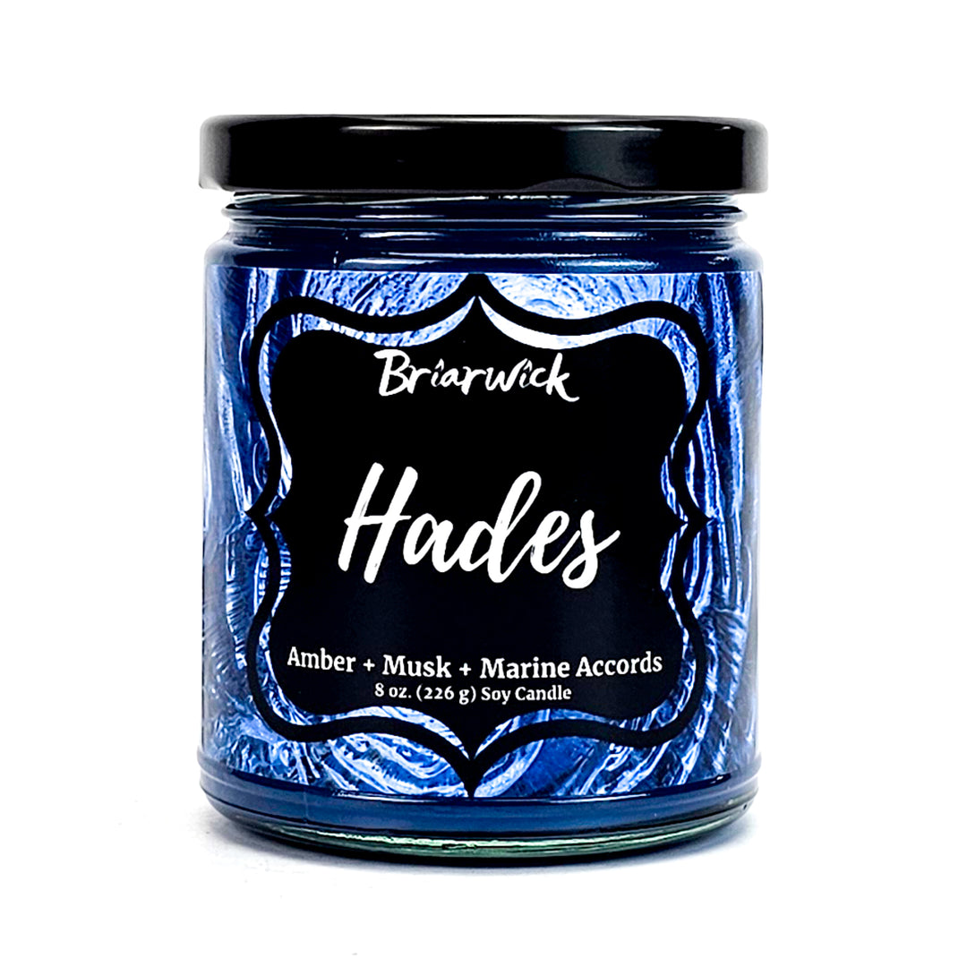 Hades 8oz navy candle with blue spiral design on a white background