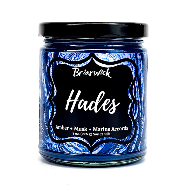 Hades 8oz navy candle with blue spiral design on a white background