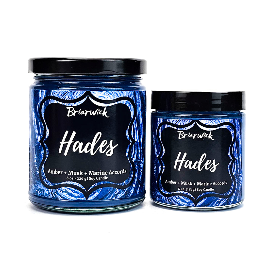 Hades 8oz & 4oz navy candles with blue spiral designs on a white background