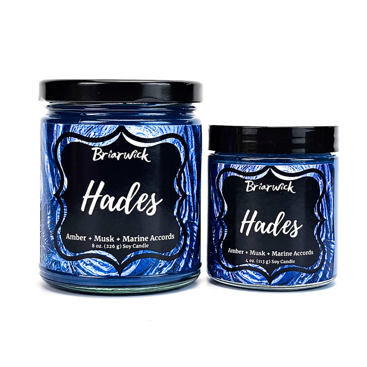 Hades 8oz & 4oz navy candles with blue spiral designs on a white background