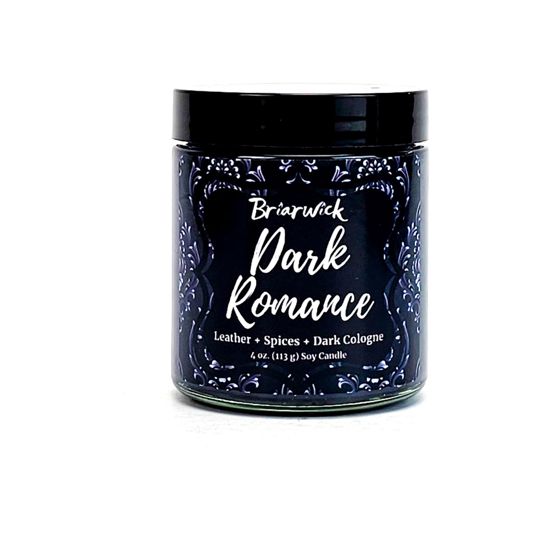 Dark Romance 4oz black candle with gray ornamental design on a white background