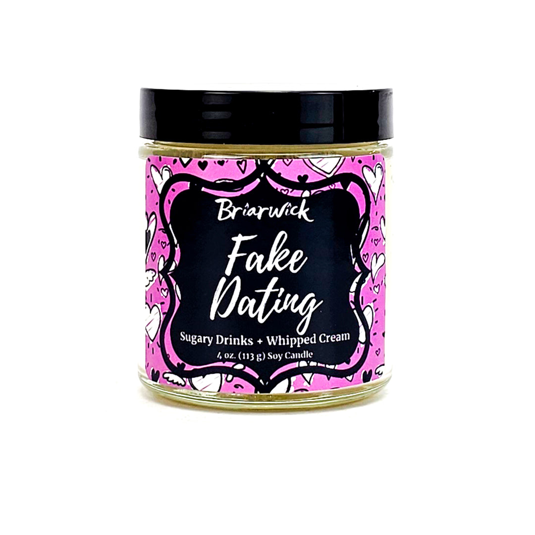 Fake Dating 4oz white candle with pink heart design on a white background
