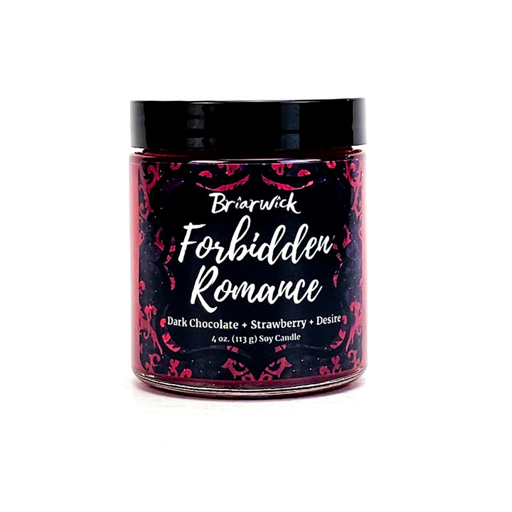 Forbidden Romance 4oz burgundy candle with red ornamental design on a white background