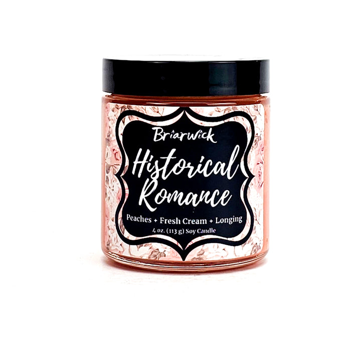 Historical Romance 4oz dusty orange candle with pale orange floral design on a white background
