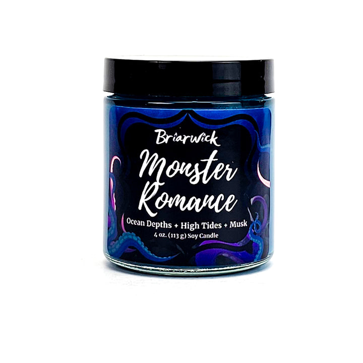 Monster Romance 4oz navy candle with blue tentacle design on a white background