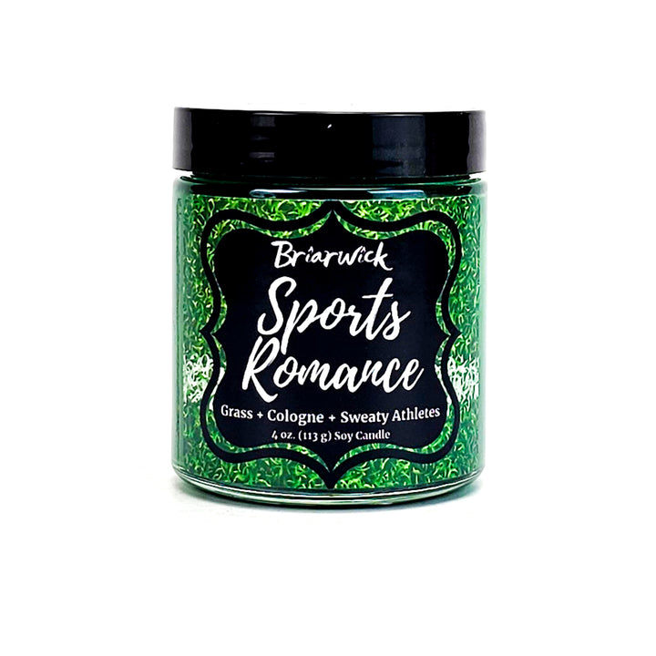 Sports Romance 4oz dark green candle with sports field design on a white background