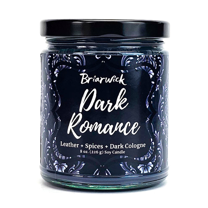 Dark Romance 8oz black candle with gray ornamental design on a white background