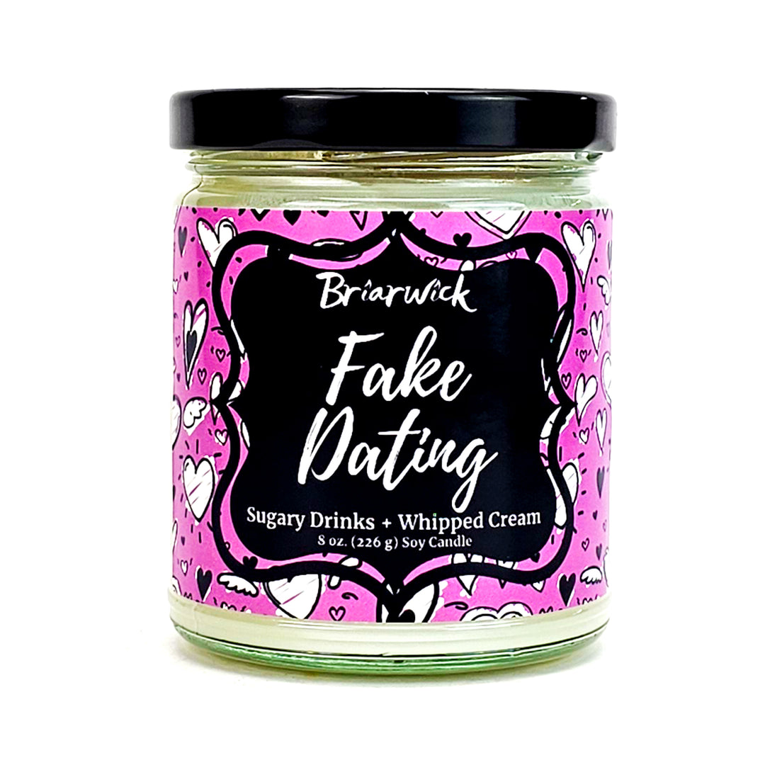Fake Dating 8oz white candle with pink heart design on a white background