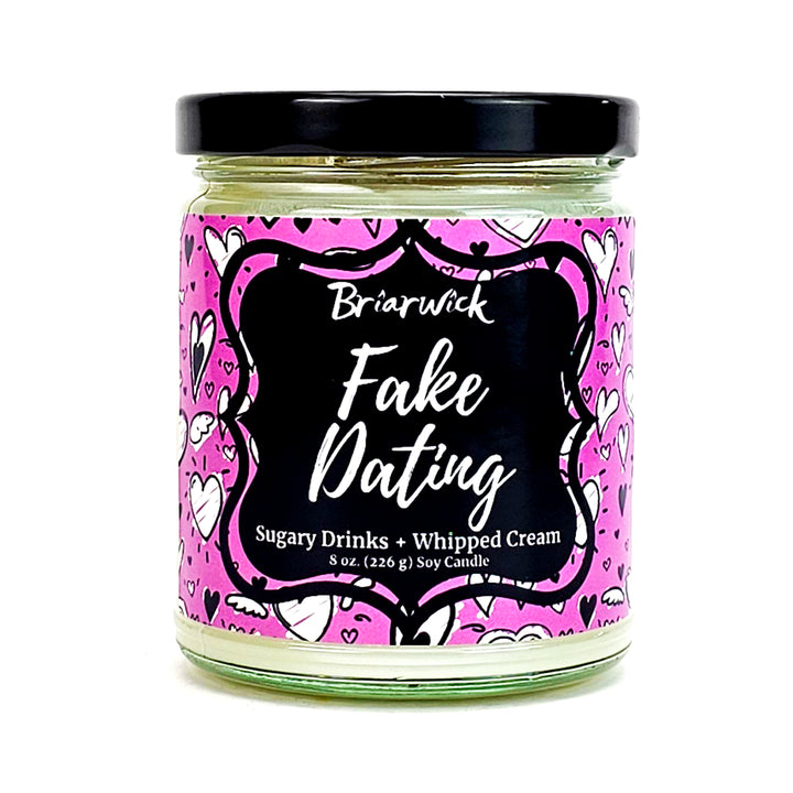 Fake Dating 8oz white candle with pink heart design on a white background
