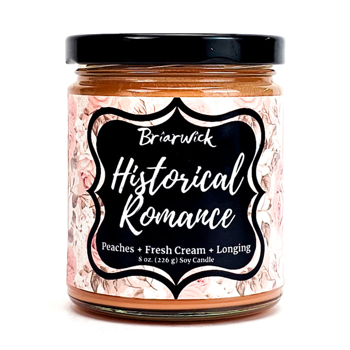 Historical Romance 8oz dusty orange candle with pale orange floral design on a white background
