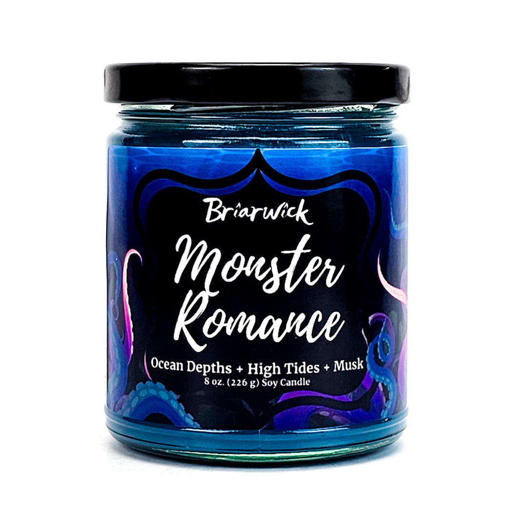Monster Romance 8oz navy candle with blue tentacle design on a white background