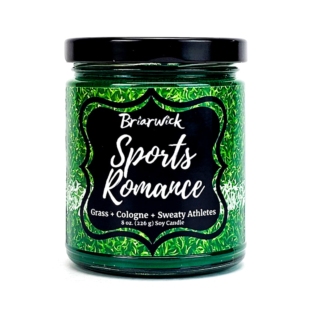 Sports Romance 8oz dark green candle with sports field design on a white background