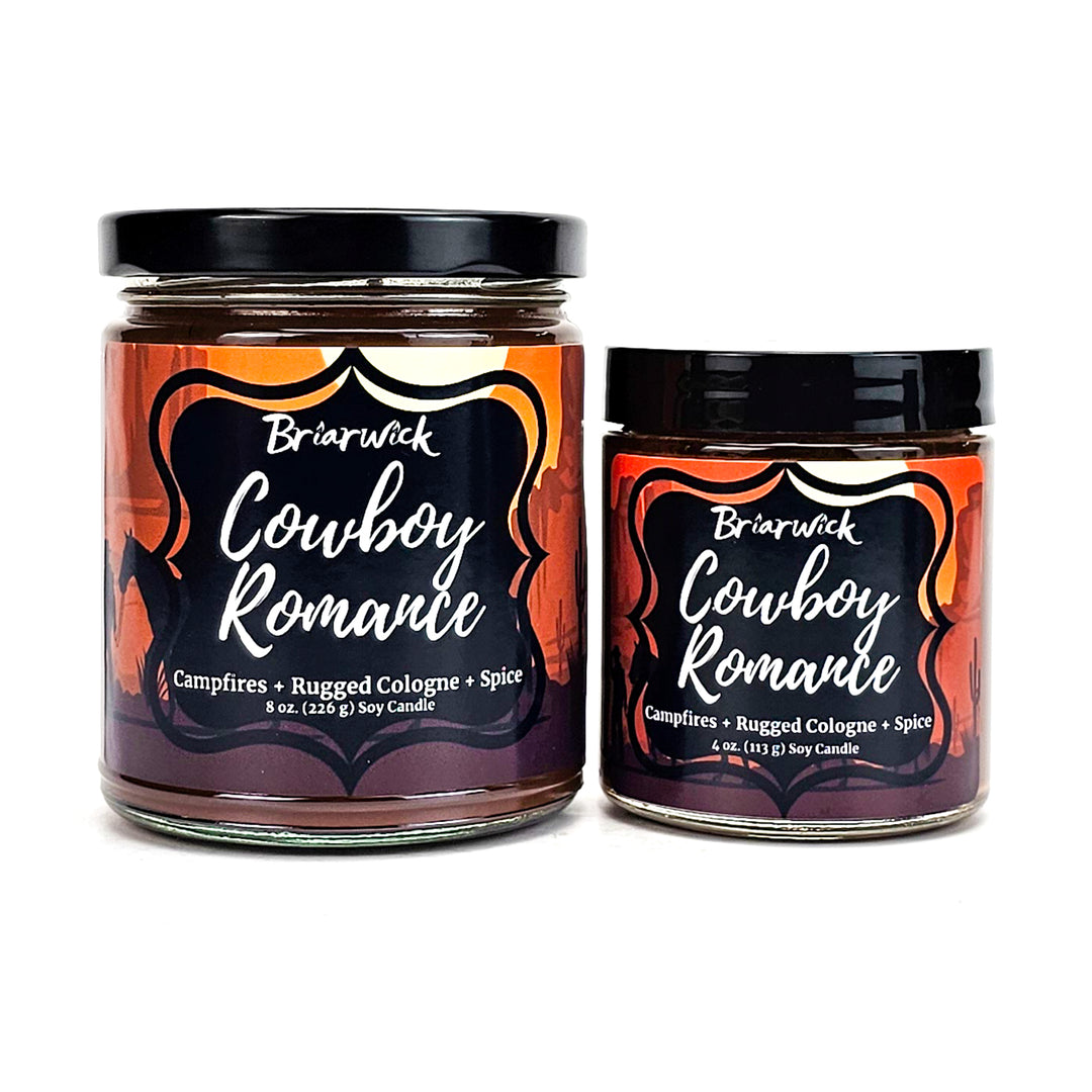 Cowboy Romance 8oz & 4oz chocolate brown candles with desert scene designs on a white background
