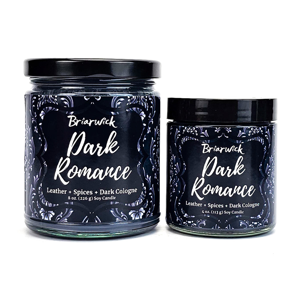 Dark Romance 8oz black candle with gray ornamental design on a white background