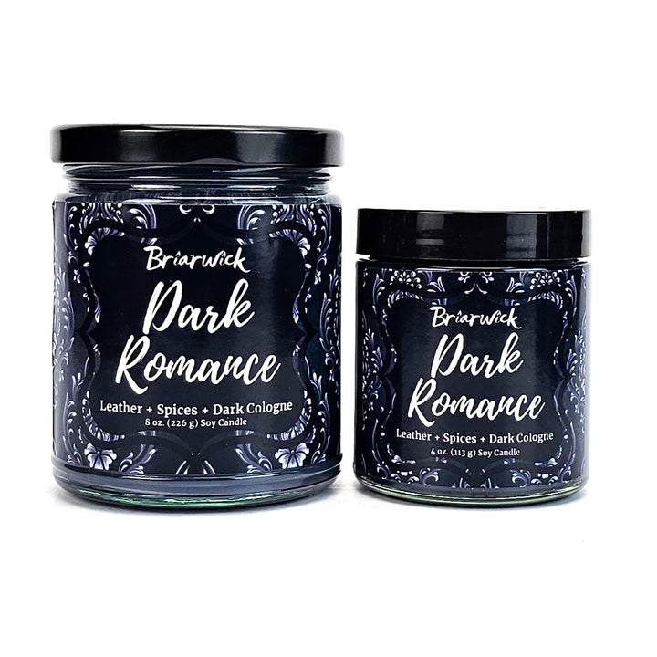 Dark Romance 8oz black candle with gray ornamental design on a white background